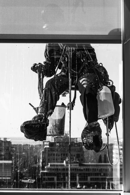 Cleaner cleaning the floor in a laboratory environment